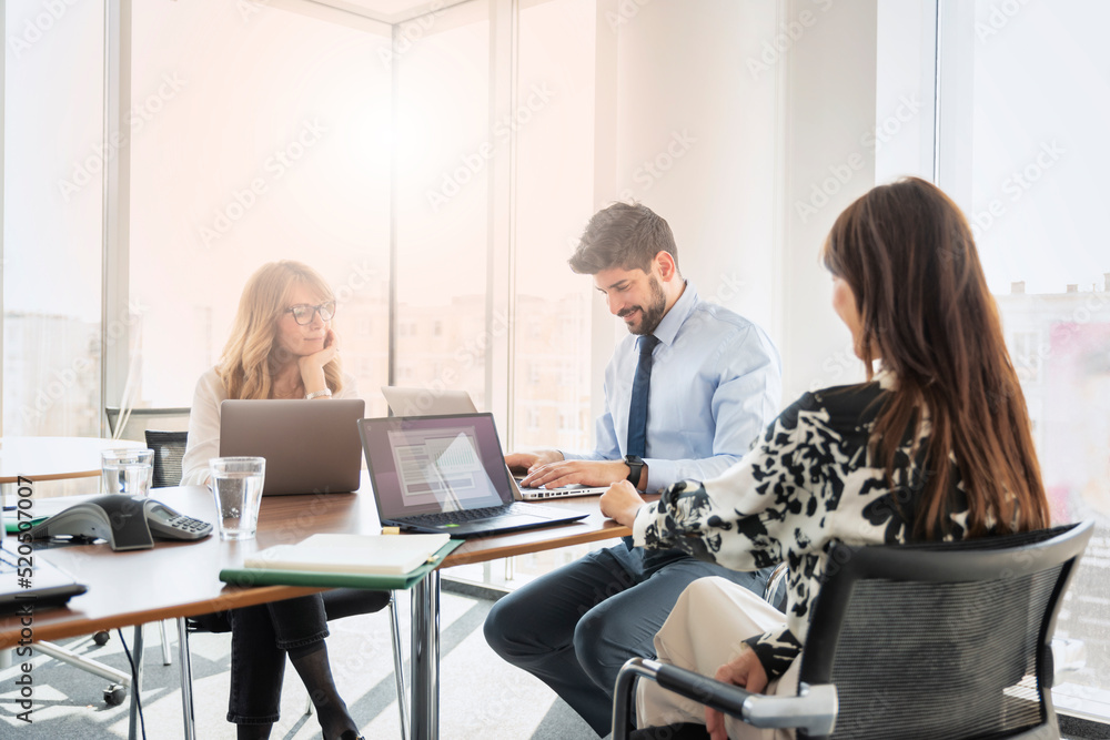 Group of business people working together at the office Group of business people working together at the office