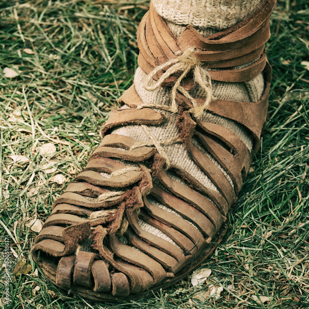 An ancient Roman man legs in caligae leather sandals. Reconstruction of the  events of the Roman Empire Stock Photo | Adobe Stock