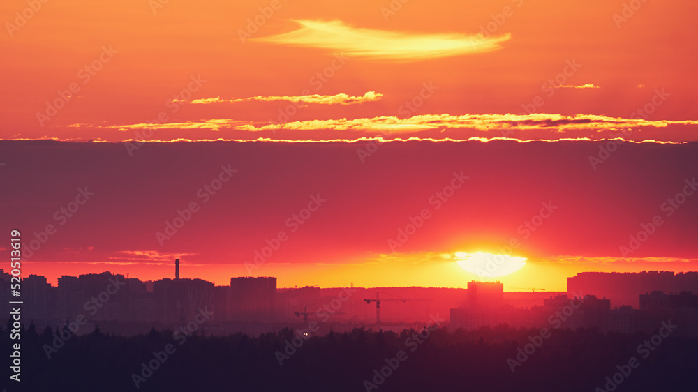 Evening sky with setting sun through clouds at sunset, cloudy landscape