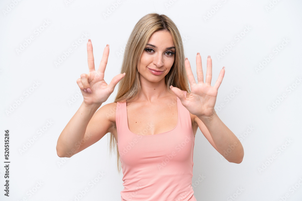 Pretty blonde woman isolated on white background counting eight with fingers Pretty blonde woman isolated on white background counting eight with fingers