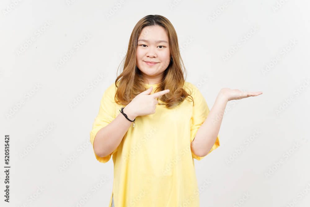 Showing and Presenting Product on Open Palm of Beautiful Asian Woman wearing yellow T-Shirt Showing and Presenting Product on Open Palm of Beautiful Asian Woman wearing yellow T-Shirt