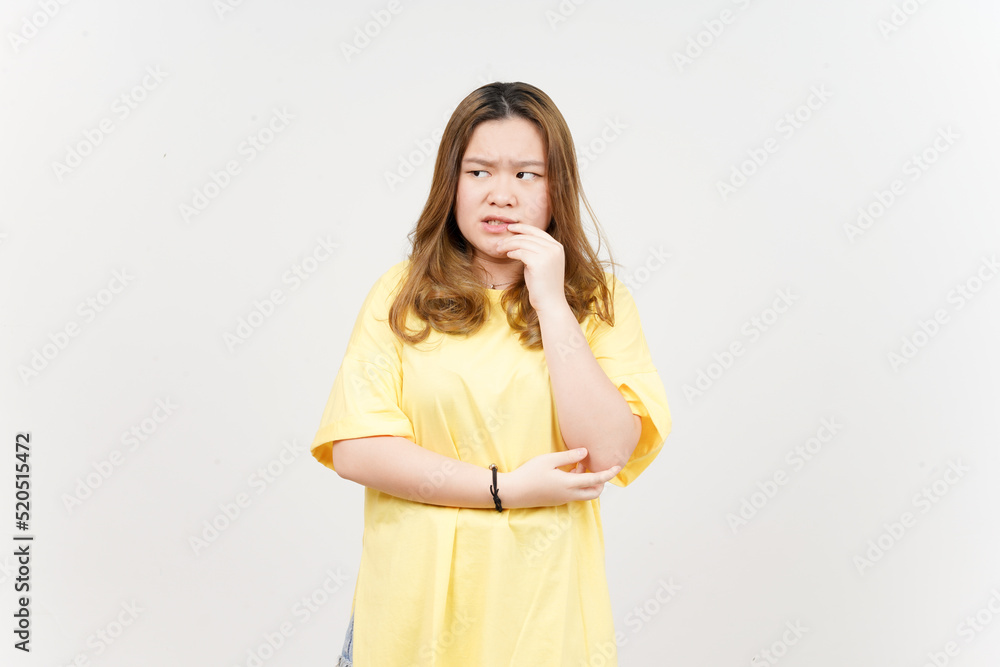 Afraid , nervous and bite nails of Beautiful Asian Woman wearing yellow T-Shirt Isolated On White Afraid , nervous and bite nails of Beautiful Asian Woman wearing yellow T-Shirt Isolated On White