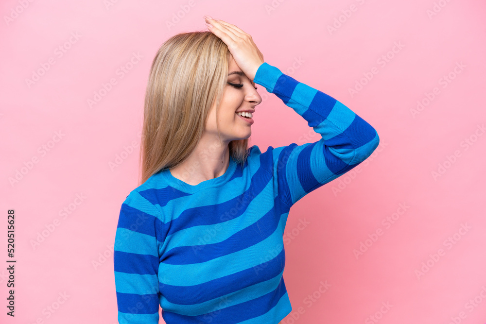 Fototapeta premium Pretty blonde woman isolated on pink background has realized something and intending the solution