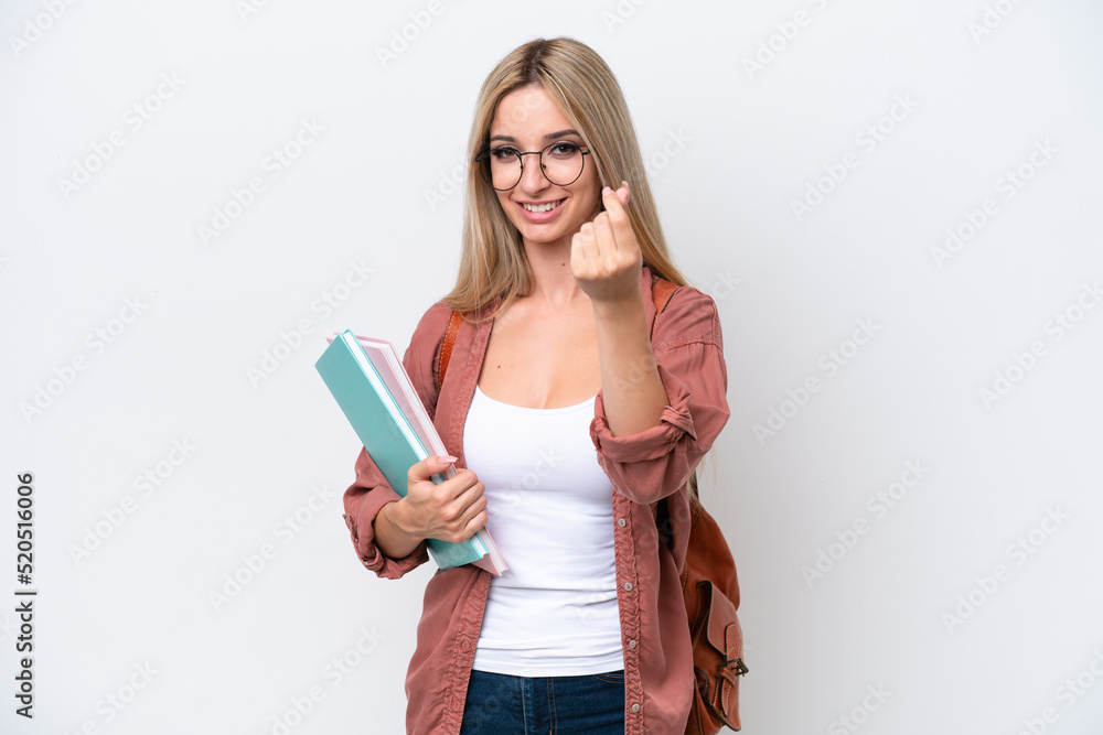 Pretty student blonde woman isolated on white background making money gesture Pretty student blonde woman isolated on white background making money gesture