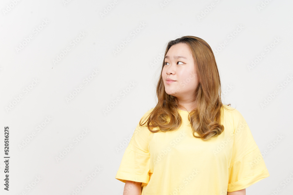 Smile and Looking away of Beautiful Asian Woman wearing yellow T-Shirt Isolated On White Background Smile and Looking away of Beautiful Asian Woman wearing yellow T-Shirt Isolated On White Background