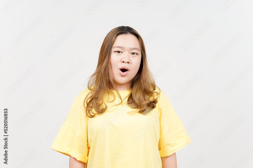 WOW face expression of Beautiful Asian Woman wearing yellow T-Shirt Isolated On White Background