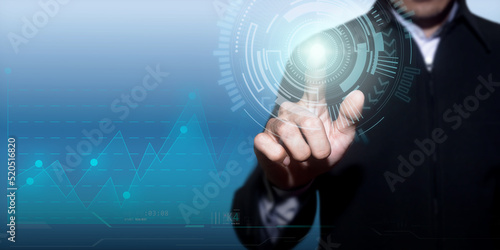 Financial stock trading graph. Businessman touching a technology concept on a touch screen with finger