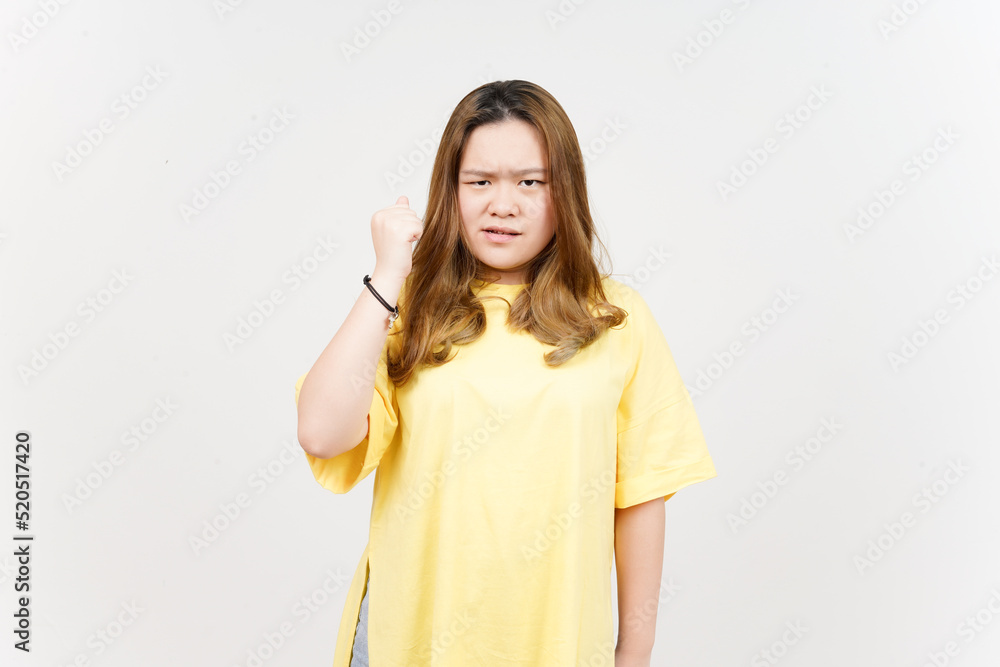 Angry gesture of Beautiful Asian Woman wearing yellow T-Shirt Isolated On White Background Angry gesture of Beautiful Asian Woman wearing yellow T-Shirt Isolated On White Background