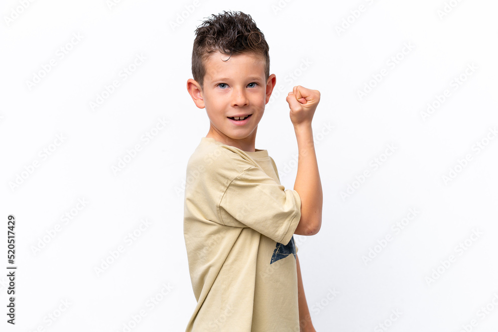 Little caucasian boy isolated on white background doing strong gesture Little caucasian boy isolated on white background doing strong gesture