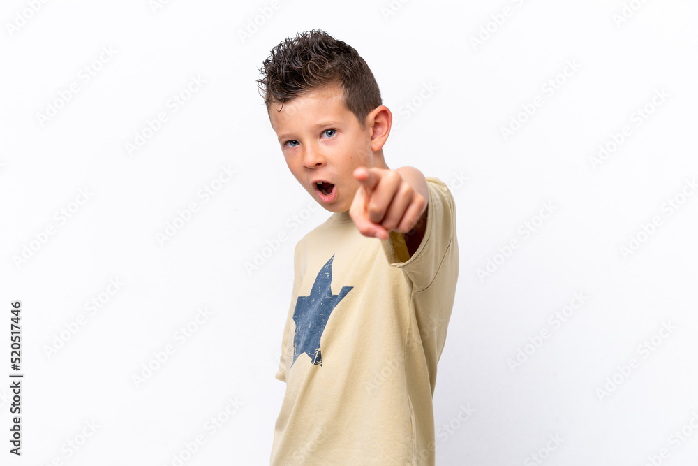 Little caucasian boy isolated on white background frustrated and pointing to the front Little caucasian boy isolated on white background frustrated and pointing to the front