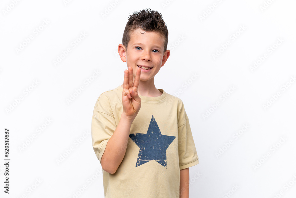 Little caucasian boy isolated on white background happy and counting three with fingers Little caucasian boy isolated on white background happy and counting three with fingers