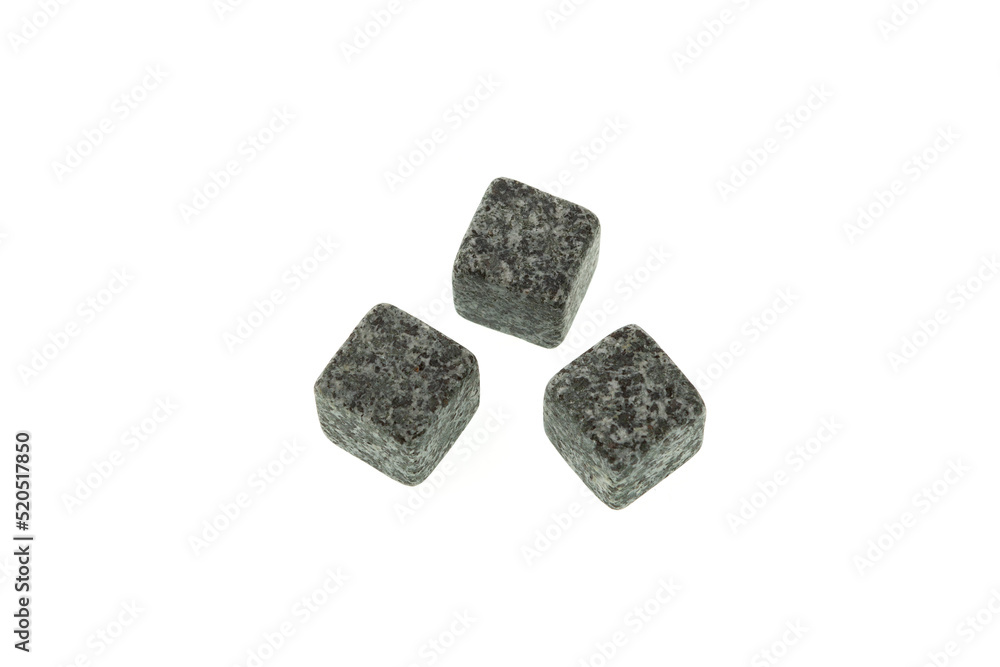 Whiskey stones isolated on white background, close-up. Design element, template. Whiskey Stones chill fine beverages without diluting them. Grey rock cubes for drinks Whiskey stones isolated on white background, close-up. Design element, template. Whiskey Stones chill fine beverages without diluting them. Grey rock cubes for drinks