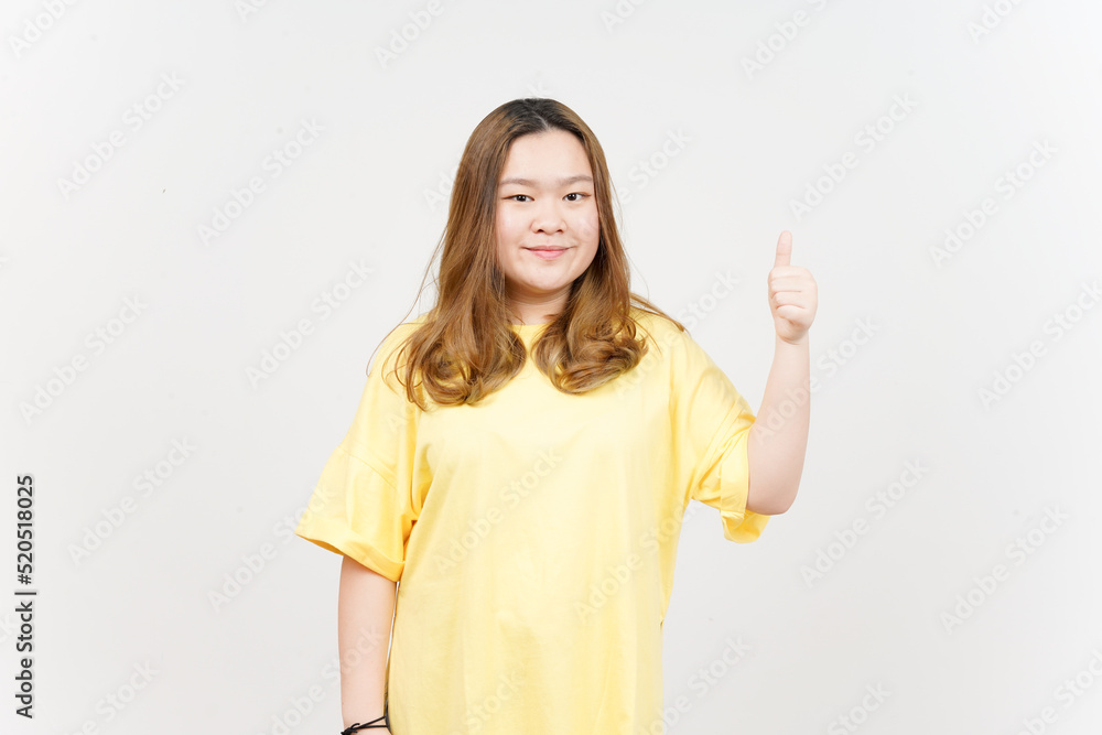 Smile and Showing thumbs up of Beautiful Asian Woman wearing yellow T-Shirt Isolated On White Smile and Showing thumbs up of Beautiful Asian Woman wearing yellow T-Shirt Isolated On White