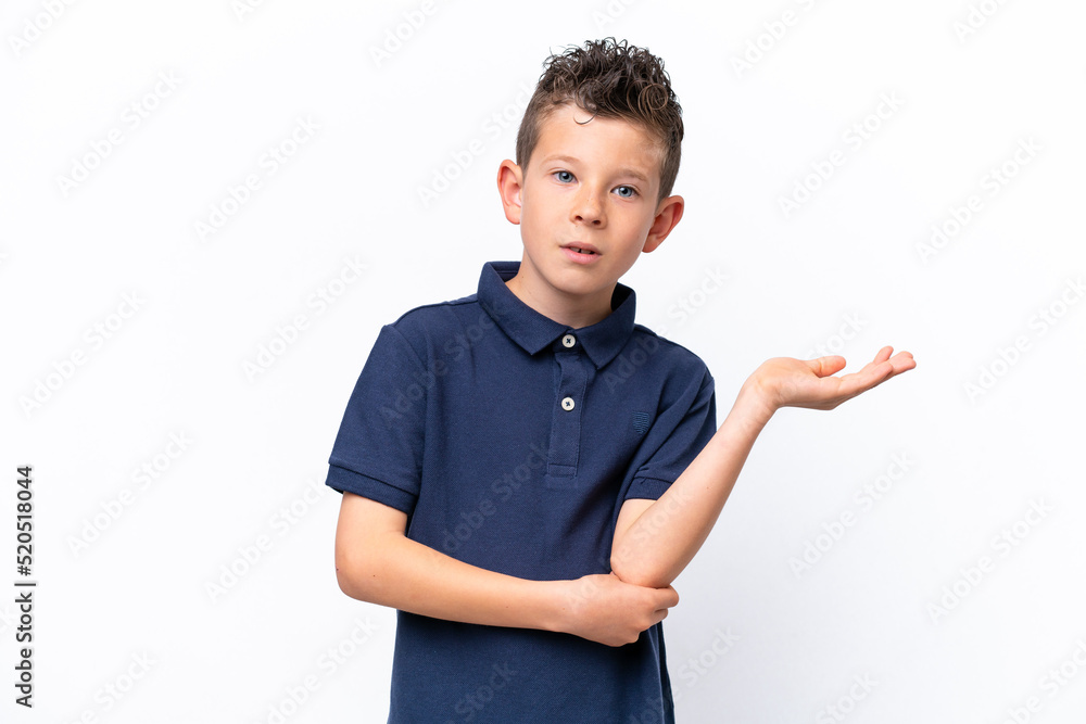 Little caucasian boy isolated on white background having doubts Little caucasian boy isolated on white background having doubts