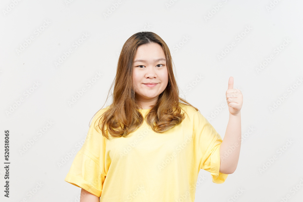 Smile and Showing thumbs up of Beautiful Asian Woman wearing yellow T-Shirt Isolated On White Smile and Showing thumbs up of Beautiful Asian Woman wearing yellow T-Shirt Isolated On White