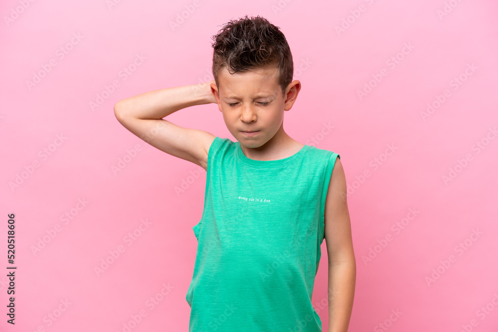 Little caucasian boy isolated on pink background with neckache