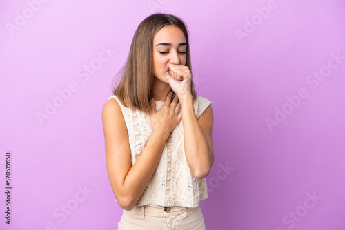 Young caucasian woman isolated on purple background coughing a lot