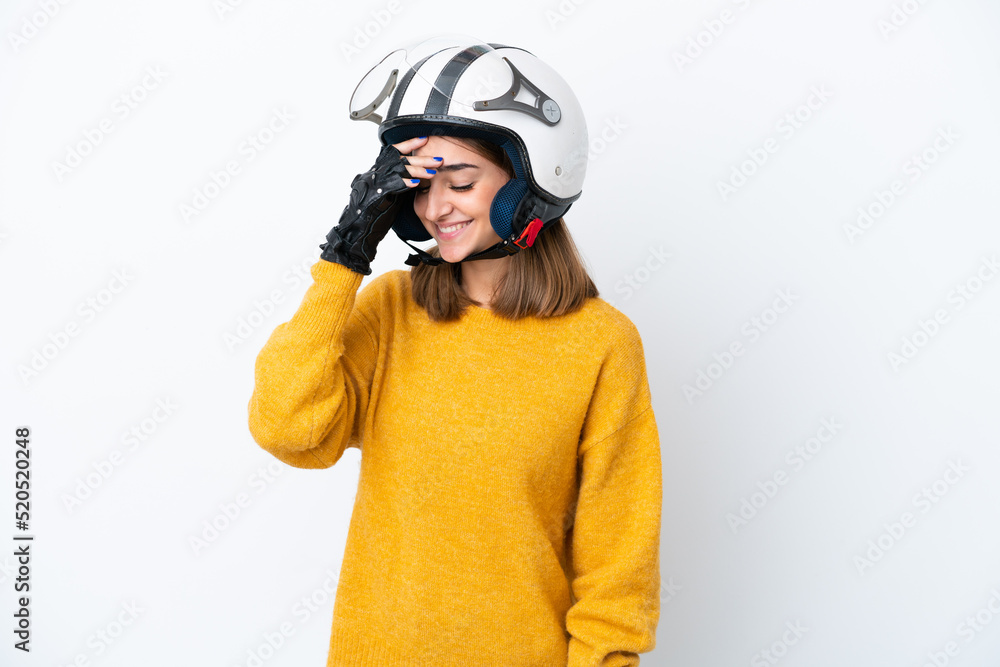 Young caucasian woman with a motorcycle helmet isolated on white background laughing Young caucasian woman with a motorcycle helmet isolated on white background laughing