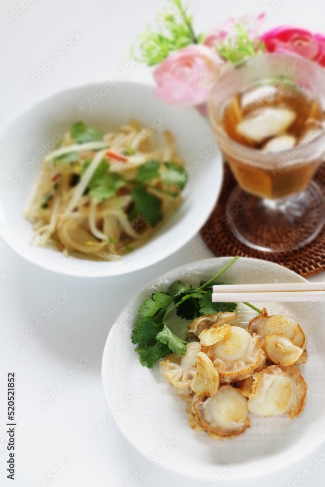 Asian food, scallop and garlic stir fried served with soy sprout Asian food, scallop and garlic stir fried served with soy sprout
