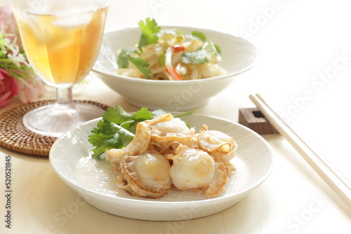 Asian food, scallop and garlic stir fried served with soy sprout