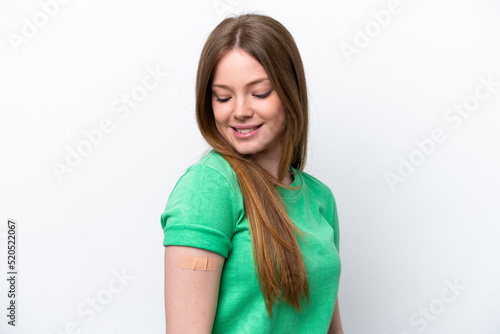 Young caucasian woman wearing a band aids isolated on white background with happy expression