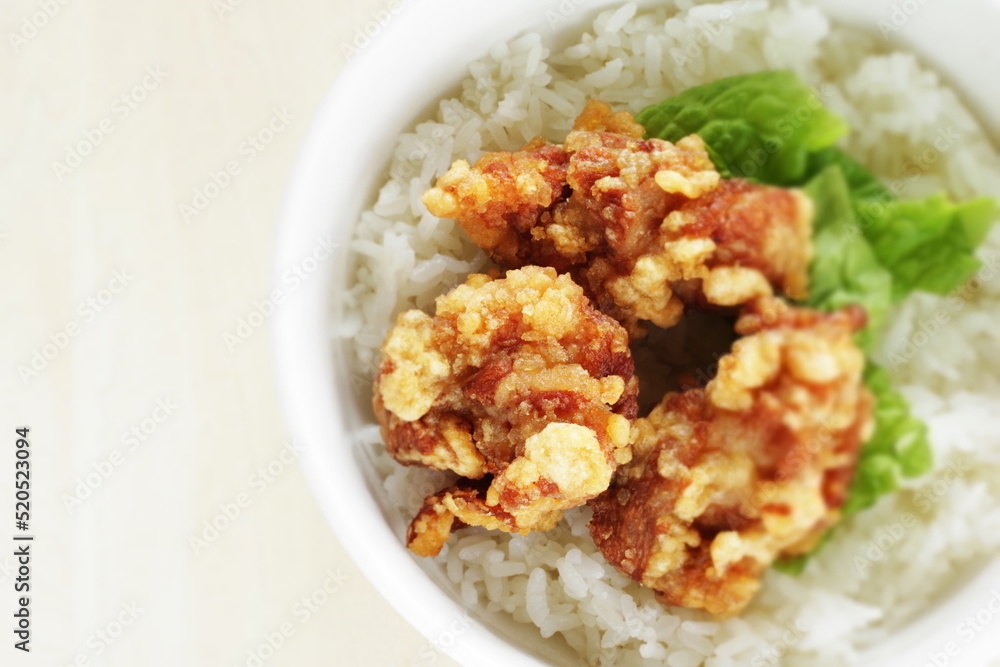 Fried chicken and lettuce on rice for Asian lunch meal image Fried chicken and lettuce on rice for Asian lunch meal image