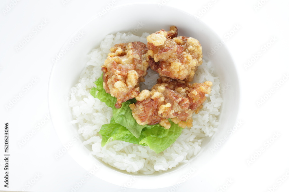 Fried chicken and lettuce on rice for Asian lunch meal image Fried chicken and lettuce on rice for Asian lunch meal image