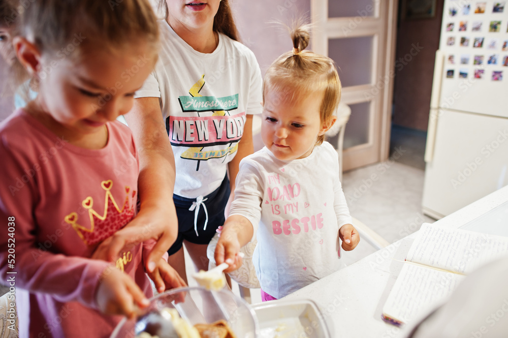 Mother with kids cooking at kitchen, happy children's moments. Mother with kids cooking at kitchen, happy children's moments.