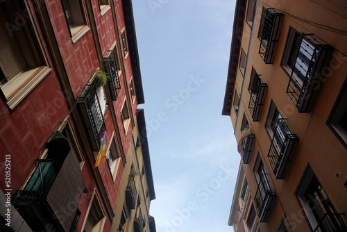 Street view looking up at apartment block in city Madrid. Traditional architecture of Madrid, Spain