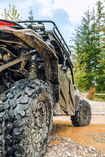 UTV in the woods dirty from mud