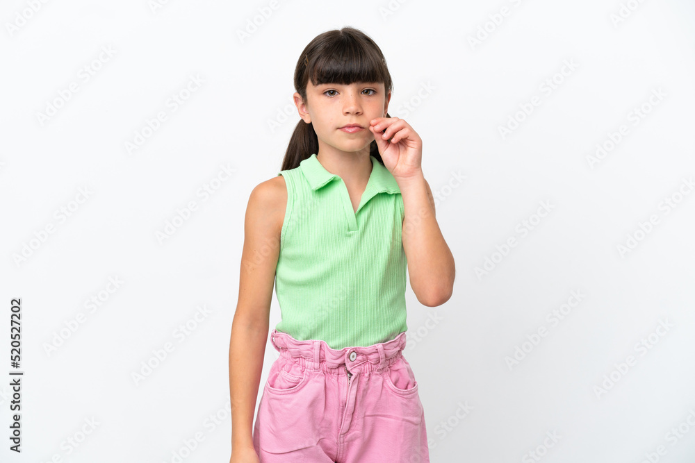 Little caucasian kid isolated on white background showing a sign of silence gesture Little caucasian kid isolated on white background showing a sign of silence gesture
