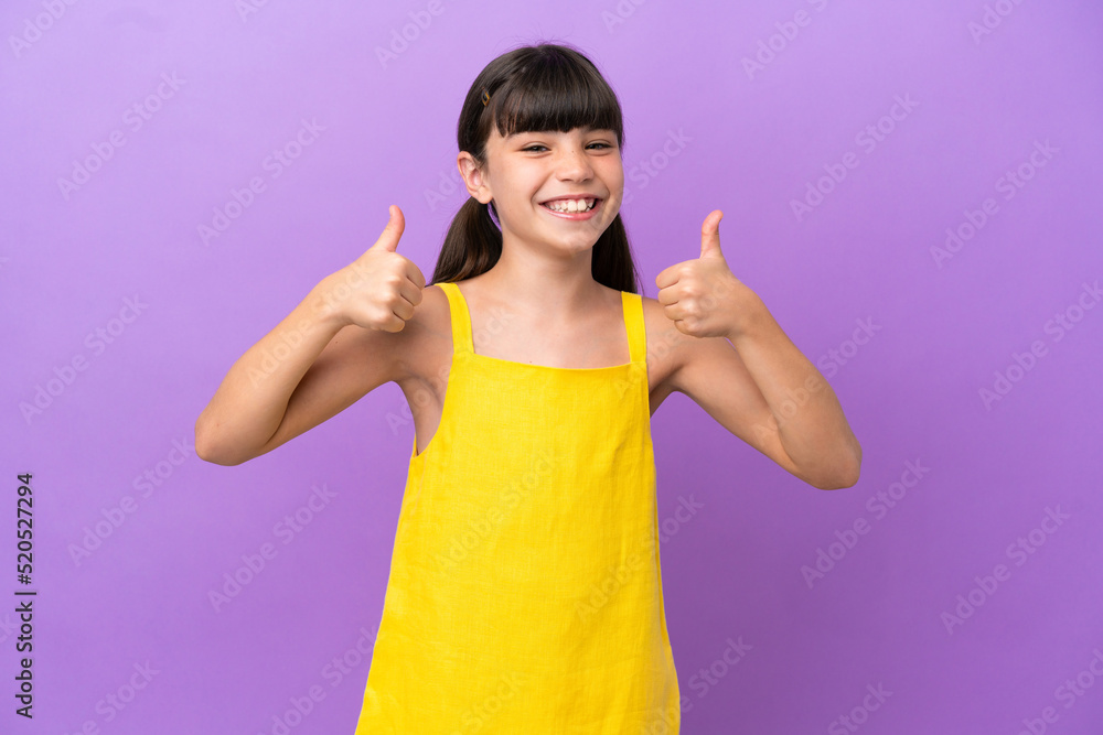 Little caucasian kid isolated on purple background giving a thumbs up gesture Little caucasian kid isolated on purple background giving a thumbs up gesture