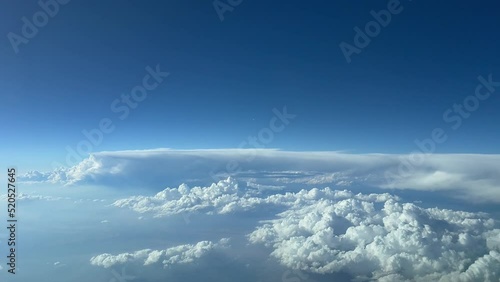 Aerial view from a cockpit jet flying at 12000 metres tigh toward a stormy and bad weather aera, 4K, 60 FPS. photo