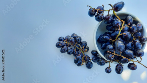 Flat Lay, Purple grapes in bowl with stem isolated on white background 03
