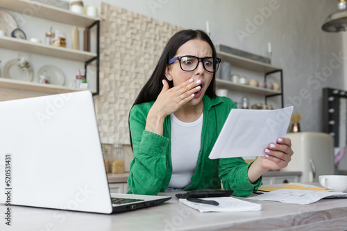 Attractive young business woman holding, clutching crumpled paper. Young university student get angry and grimace face negative emotion that she can not finish work or homework, difficult work