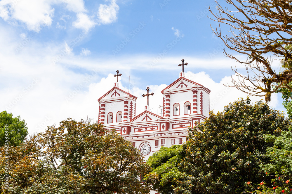 Fototapeta premium Guatape, Antioquia - Colombia - June 25, 2022. Our Lady of Carmen Catholic Church Facade.