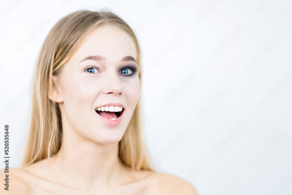 Laughing girl with one eye makeup. Close-up. Laughing girl with one eye makeup. Close-up.