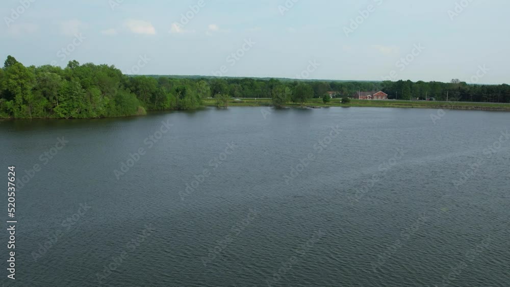 An Aerial view of a house and trees on the shore of lake. Nature background An Aerial view of a house and trees on the shore of lake. Nature background