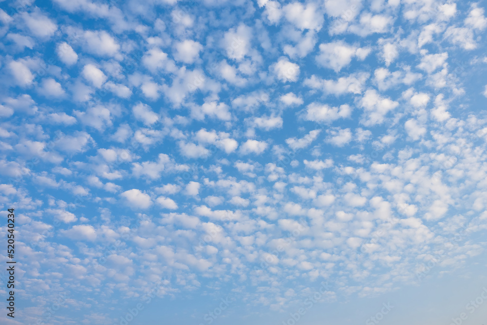 Sky with beautiful clouds. Blue sky with many small clouds. Sky landscape in sunny weather. Beautiful clouds in summer weather. Skywards landscape for background or wallpaper. Natural background Sky with beautiful clouds. Blue sky with many small clouds. Sky landscape in sunny weather. Beautiful clouds in summer weather. Skywards landscape for background or wallpaper. Natural background