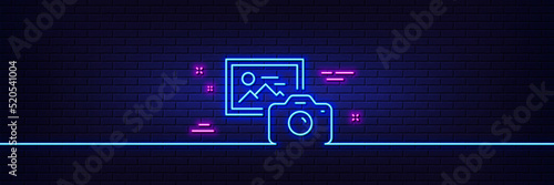 Neon light glow effect. Photo camera line icon. Image photography sign. Picture placeholder symbol. 3d line neon glow icon. Brick wall banner. Photo camera outline. Vector
