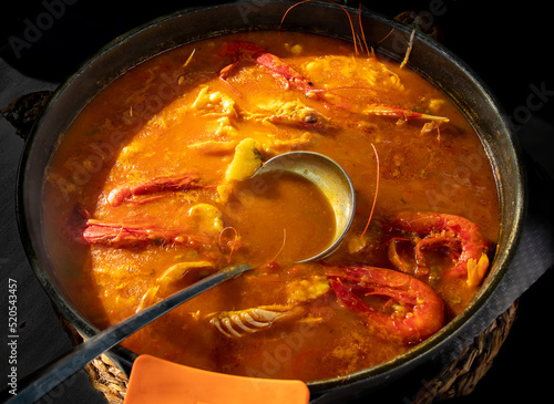 Foto Soupy rice casserole with carabineros