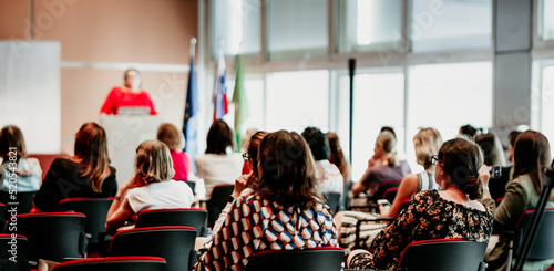 Photography Woman giving presentation on business conference event.
