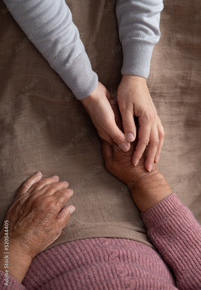 Old and young holding hands old age support help old people