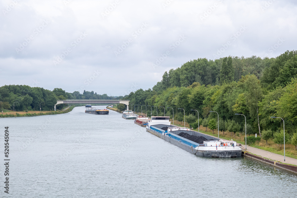 Naklejka premium Inland vessel moored to a canal