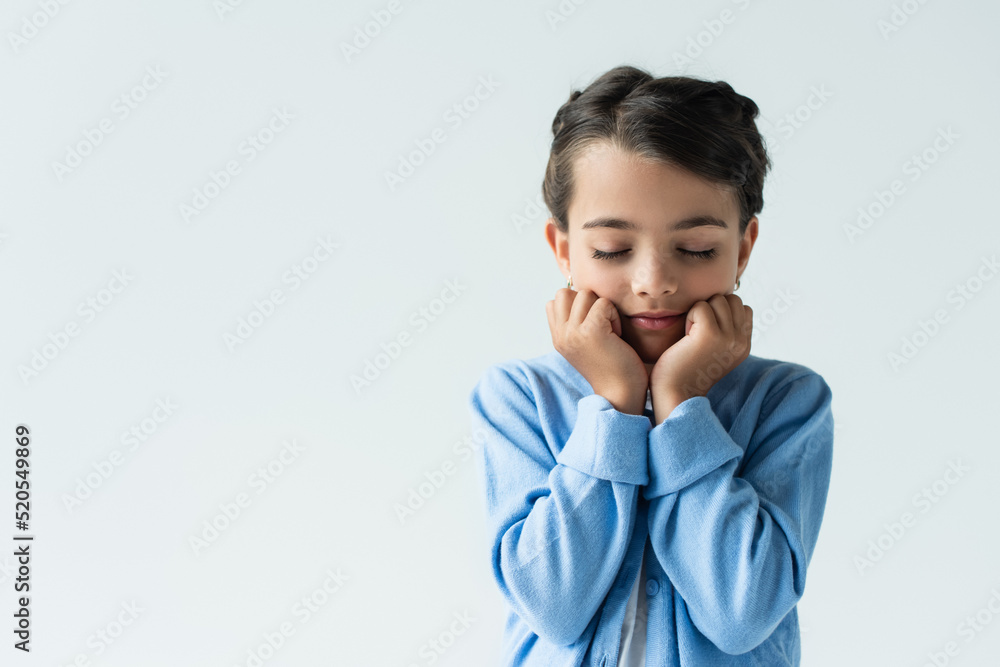 frustrated girl with closed eyes holding hands near face isolated on grey, banner frustrated girl with closed eyes holding hands near face isolated on grey, banner