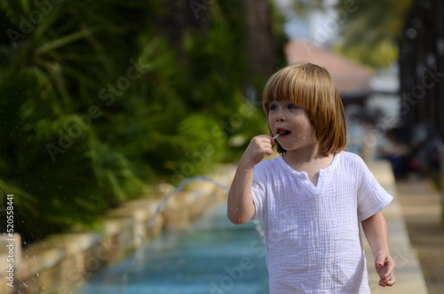 Portrait of a little boy. Child 3 years old, boy with long hair. place for text. Emotions on the face