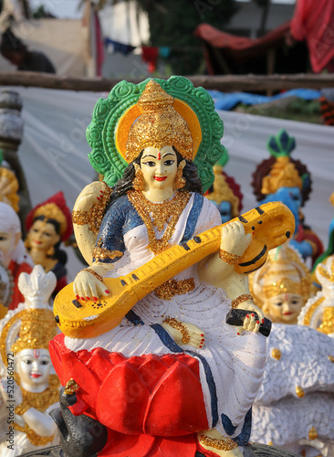 A Divine Idol of Hindu Goddess Saraswathi known as the Knowledge and wisdom deity in Vibrant color in India. 