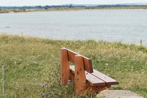 A wood seat in the field