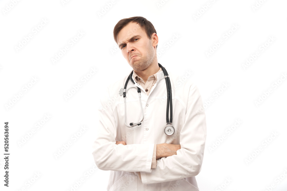 Portrait of angry doctor in white medical coat with stethoscope upset face screaming on white background with copy space Portrait of angry doctor in white medical coat with stethoscope upset face screaming on white background with copy space