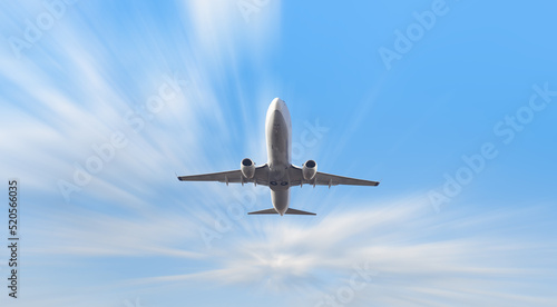 A passenger plane in motion with blur effect at sunset. Landscape with passenger airplane is flying. Aircraft with blurred background